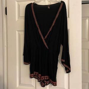 Black long sleeve romper with optional snap for the chest.